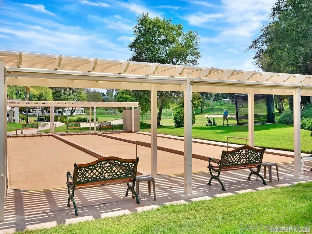 4214 Lindos Way Oceanside, CA 92056 - Photo 16 of 18 a view of a chairs and table in patio with a yard