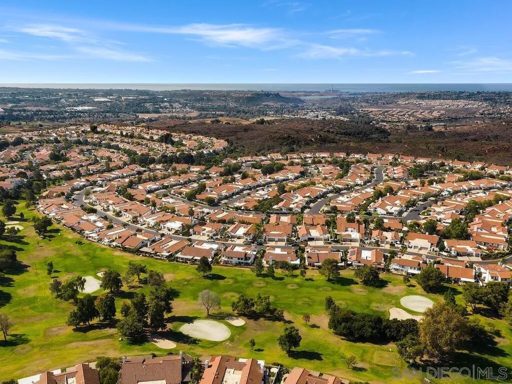 4214 Lindos Way Oceanside, CA 92056 - Photo 6 of 18 an aerial view of residential building with parking space