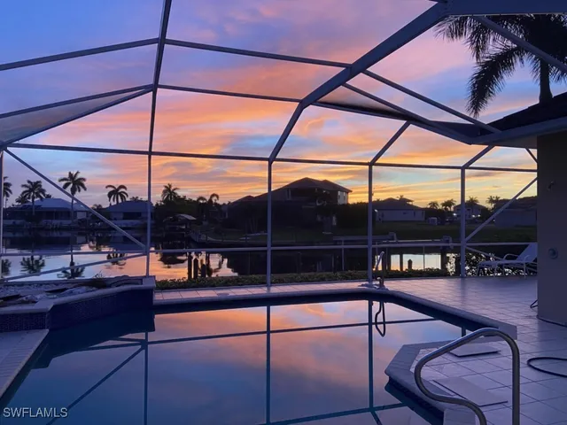 a view of a chairs and table in the balcony
