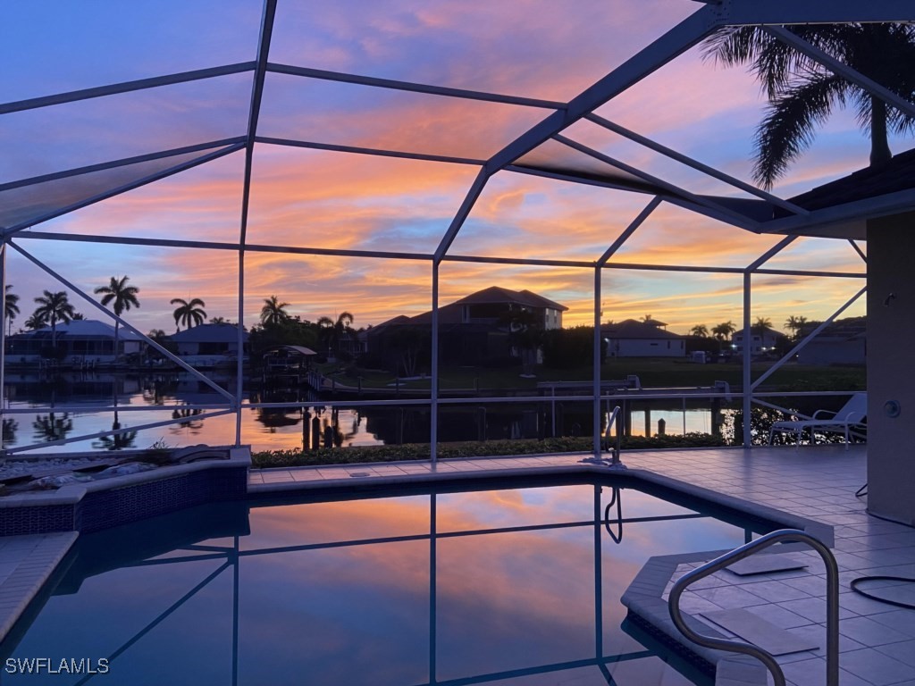 a view of a chairs and table in the balcony