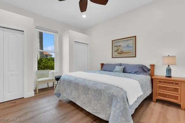 a bed room with a bed and a window