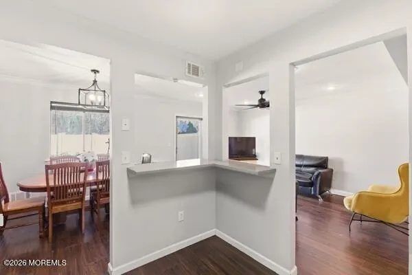 a view of kitchen with sink and wooden floor