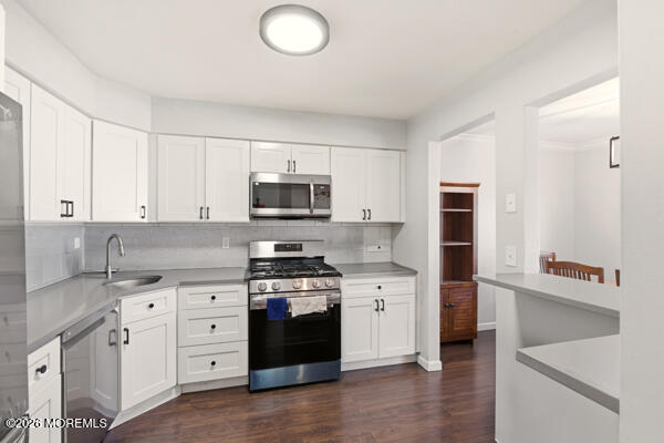 7 Tracey Court Howell, NJ 07731 - Photo 16 of 20 a kitchen with stainless steel appliances a sink stove and cabinets