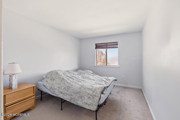 7 Tracey Court Howell, NJ 07731 - Photo 19 of 20 a bedroom with a bed and a lamp on desk