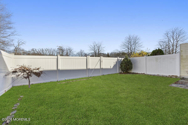 7 Tracey Court Howell, NJ 07731 - Photo 3 of 20 a view of a garden with a bench