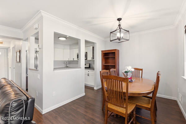 7 Tracey Court Howell, NJ 07731 - Photo 9 of 20 a view of a dining room with furniture wooden floor and a chandelier