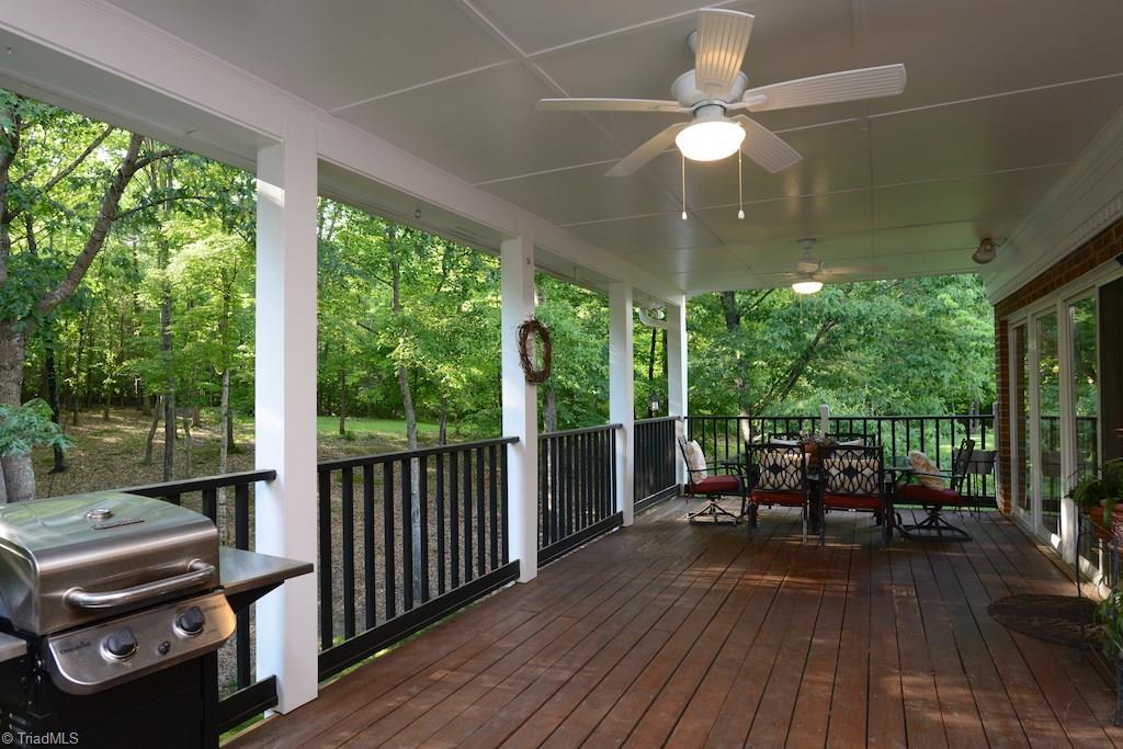 1709 Heathcliff Road High Point, NC 27262 - Photo 13 of 30 Imagine spending the entire summer on this deck in some big cozy chairs over looking your private forested yard