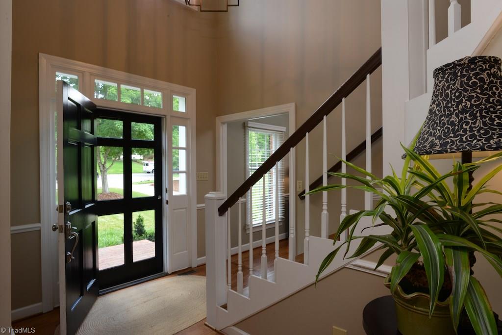 1709 Heathcliff Road High Point, NC 27262 - Photo 3 of 30 Roomy and bright foyer with hardwood floors throughout the main level