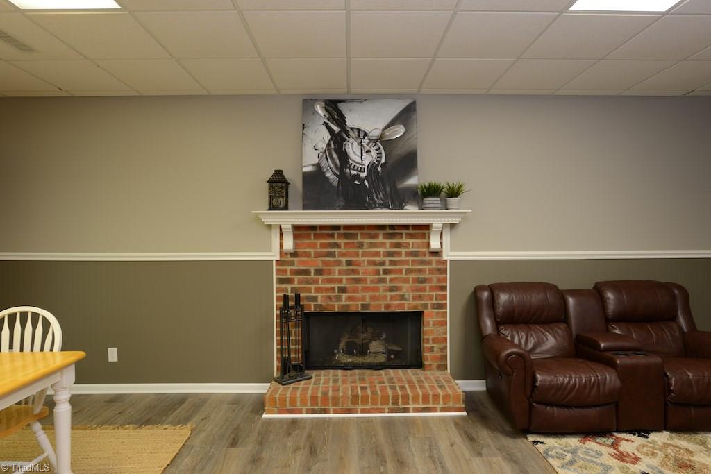 1709 Heathcliff Road High Point, NC 27262 - Photo 26 of 30 Basement has new floors and a wood burning fireplace