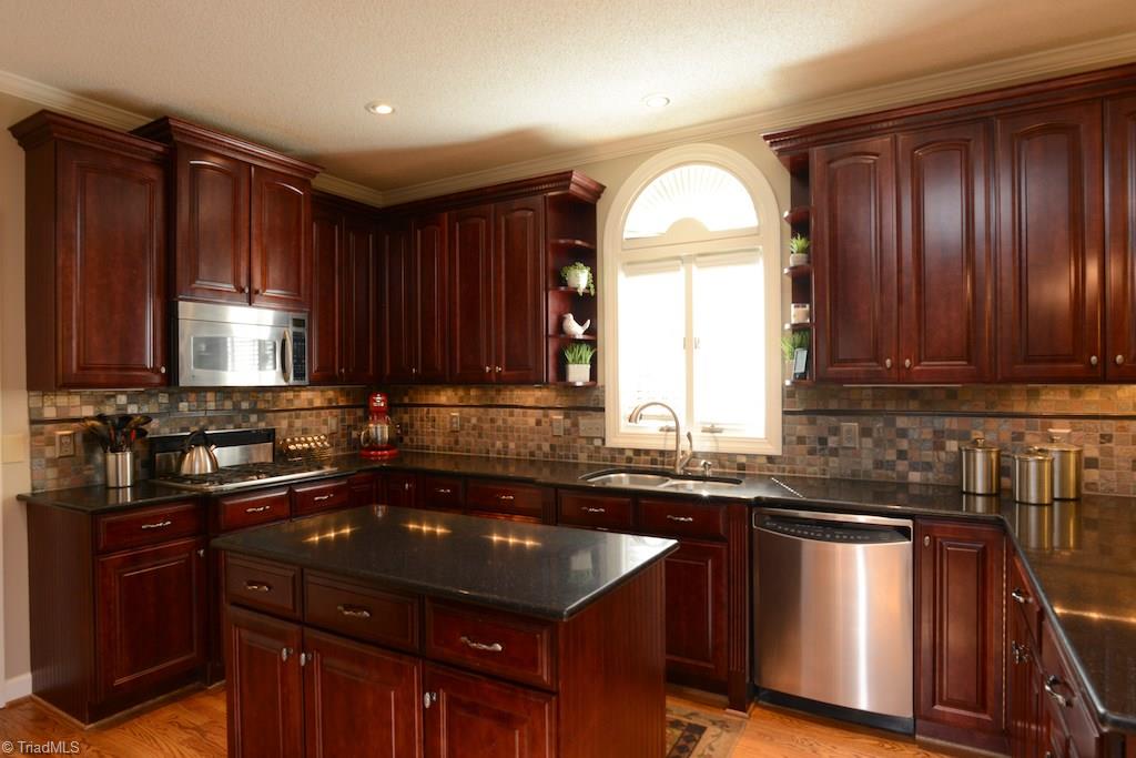 1709 Heathcliff Road High Point, NC 27262 - Photo 4 of 30 Gourmet kitchen with SS appliances, granite countertops and large island
