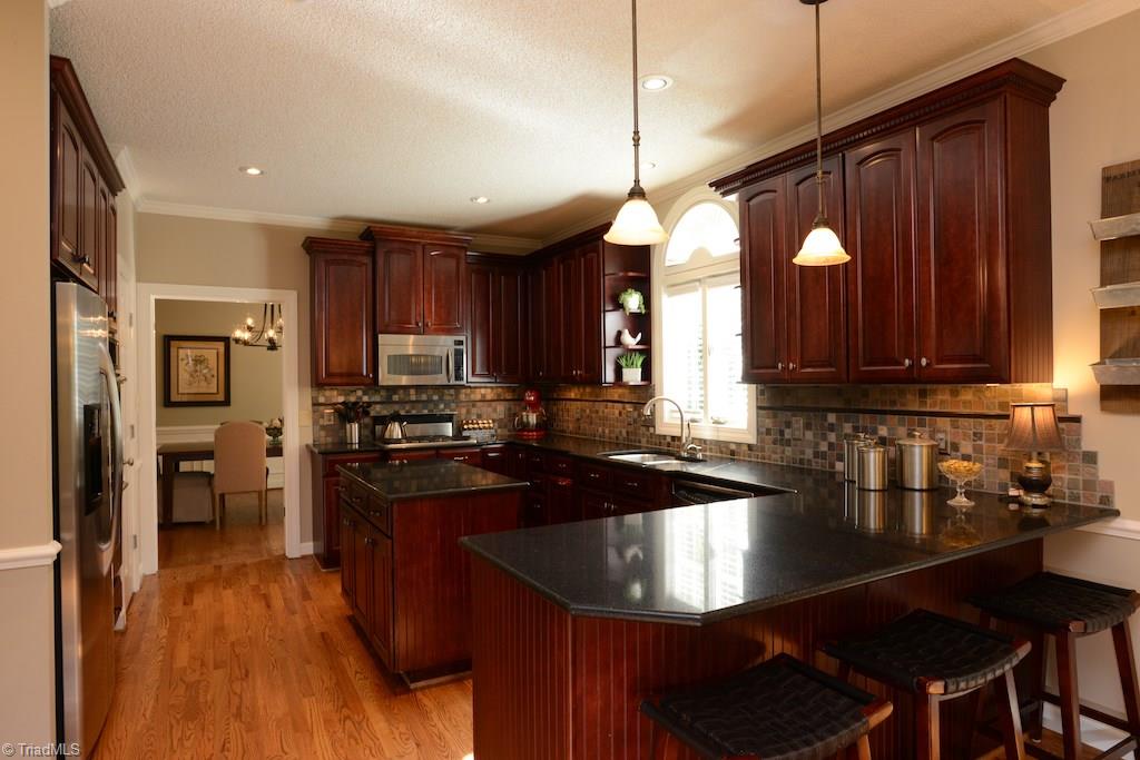 1709 Heathcliff Road High Point, NC 27262 - Photo 6 of 30 This stunning kitchen has an island and a peninsula for plenty of prep area