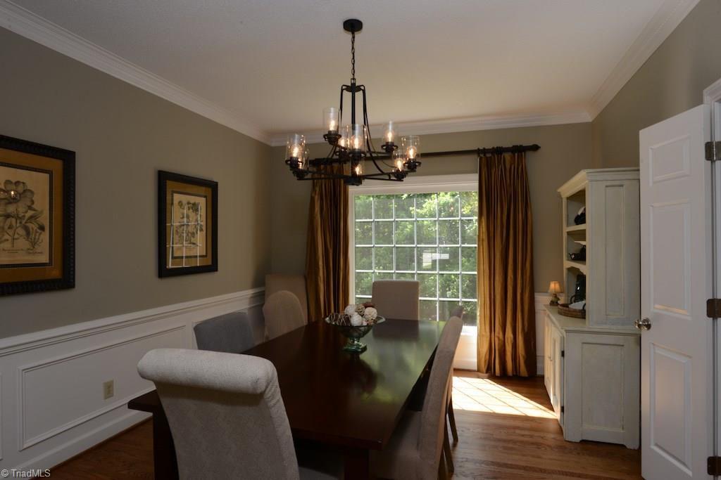 1709 Heathcliff Road High Point, NC 27262 - Photo 8 of 30 Room for the whole family in this dining room with nice moldings and chair rail..check out that huge window