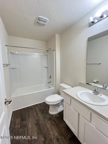 a bathroom with a sink a toilet and a bathtub