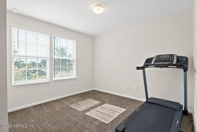 a view of a storage & utility room with a window