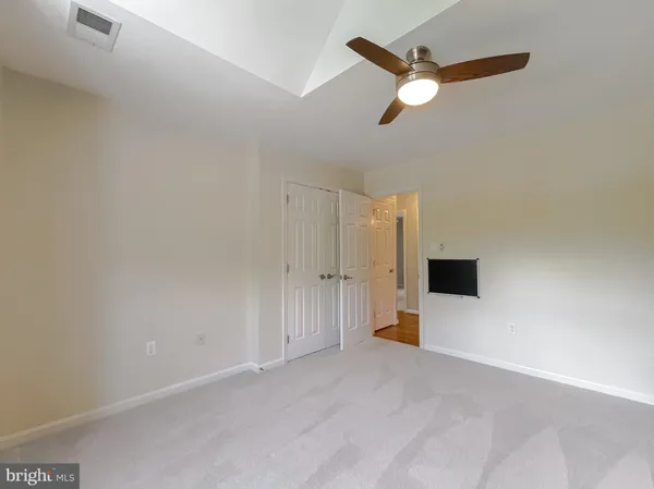 a view of a room with wooden walls