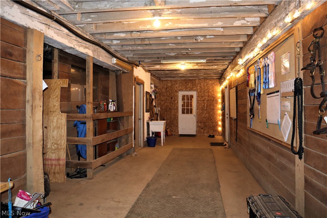 8544 River Styx Road Wadsworth, OH 44281 - Photo 18 of 35 Lower level bank barn hall. contains tack room, office, wash stall, feed stroage room.
