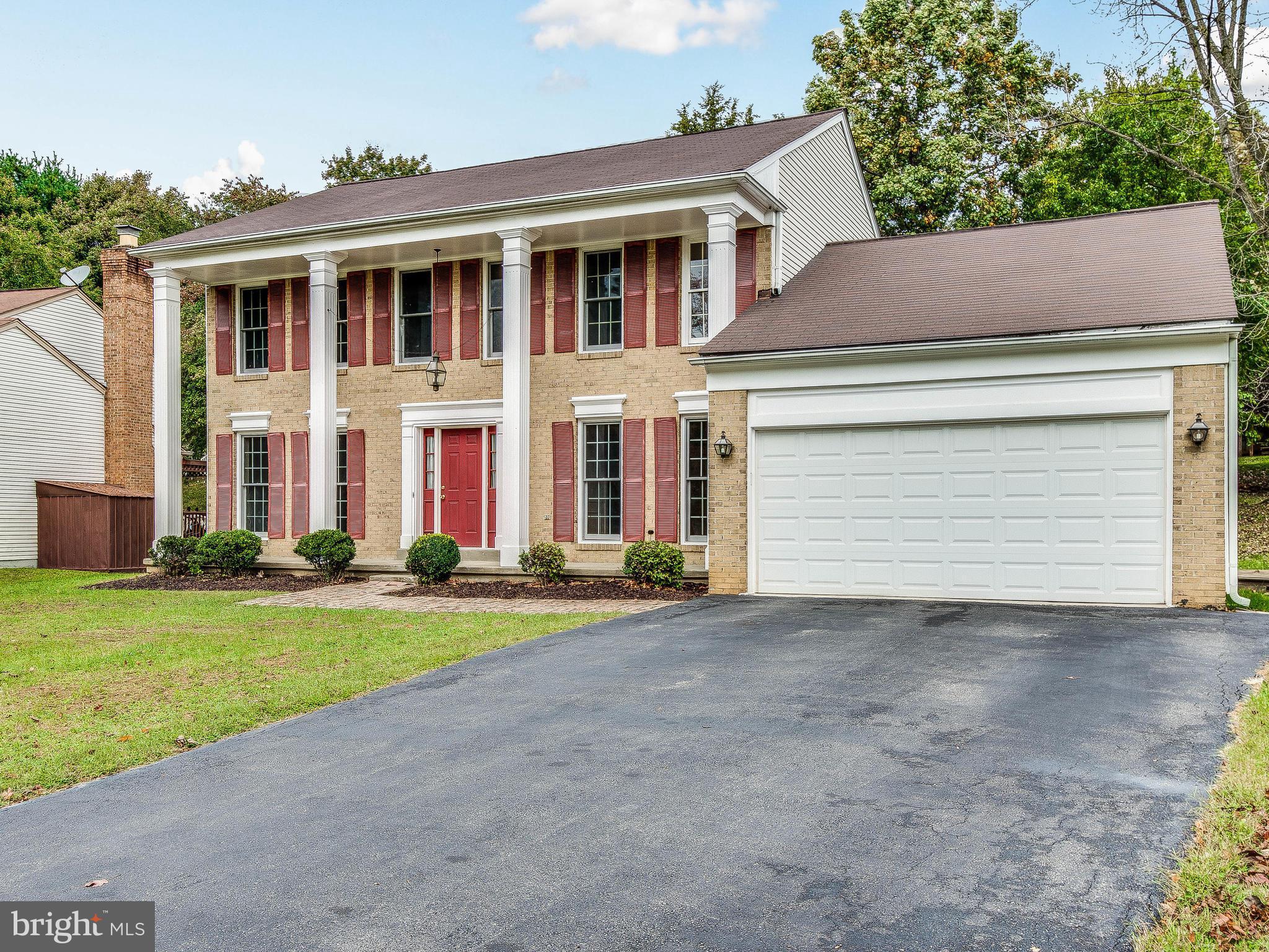 13805 Turnmore Road Silver Spring, MD 20906 - Photo 2 of 29 a front view of a house with a yard and garage