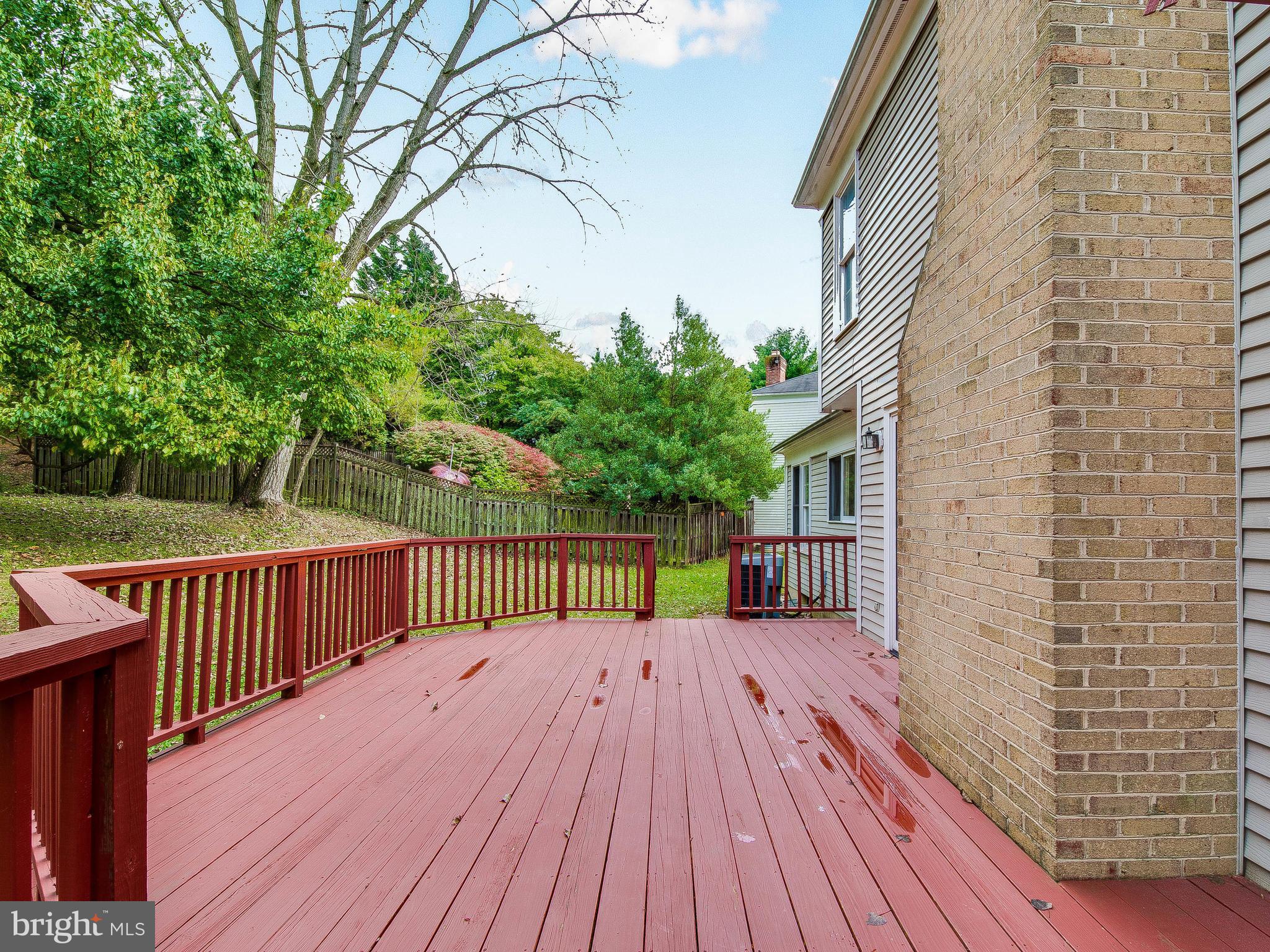 13805 Turnmore Road Silver Spring, MD 20906 - Photo 28 of 29 a view of backyard with deck and wooden floor