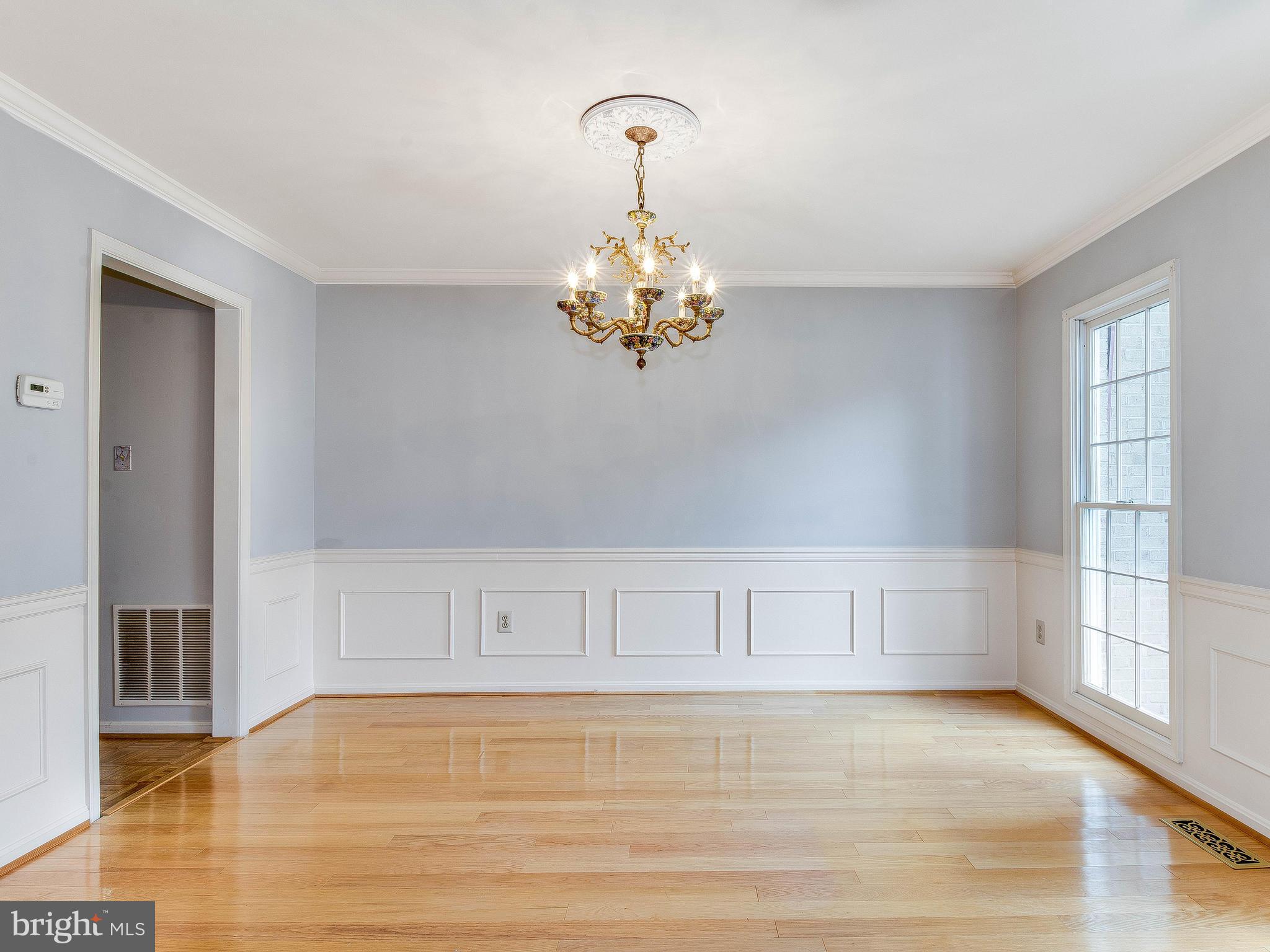 13805 Turnmore Road Silver Spring, MD 20906 - Photo 10 of 29 a view of a livingroom with an empty space & wooden floor