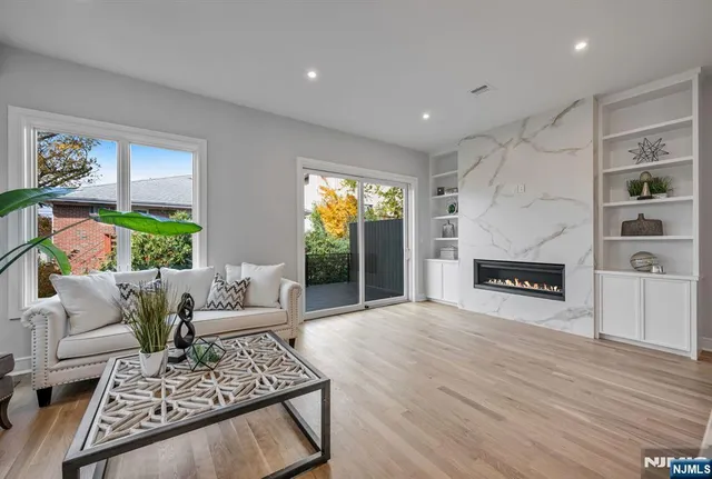 a living room with furniture and a fireplace