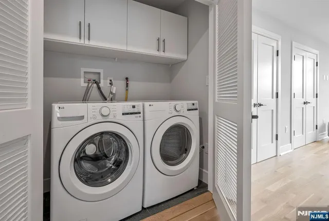 a view of a storage & utility room with washer and dryer