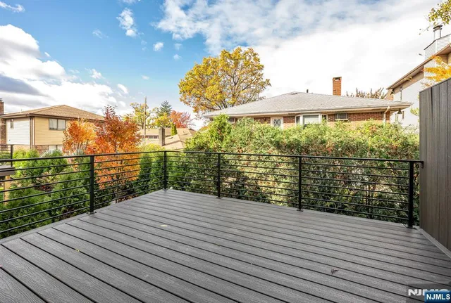 a view of a balcony with yard