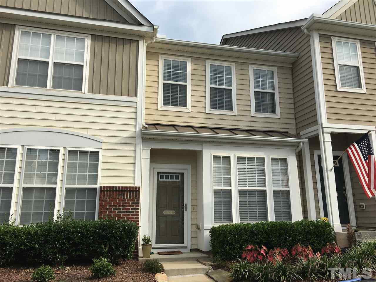 7634 Winners Edge Street Raleigh, NC 27617 - Photo 1 of 22 a front view of a house with a garden
