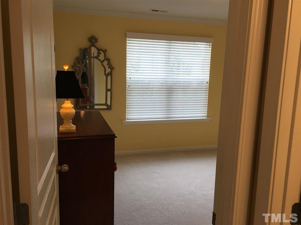 7634 Winners Edge Street Raleigh, NC 27617 - Photo 12 of 22 a view of hallway with closet