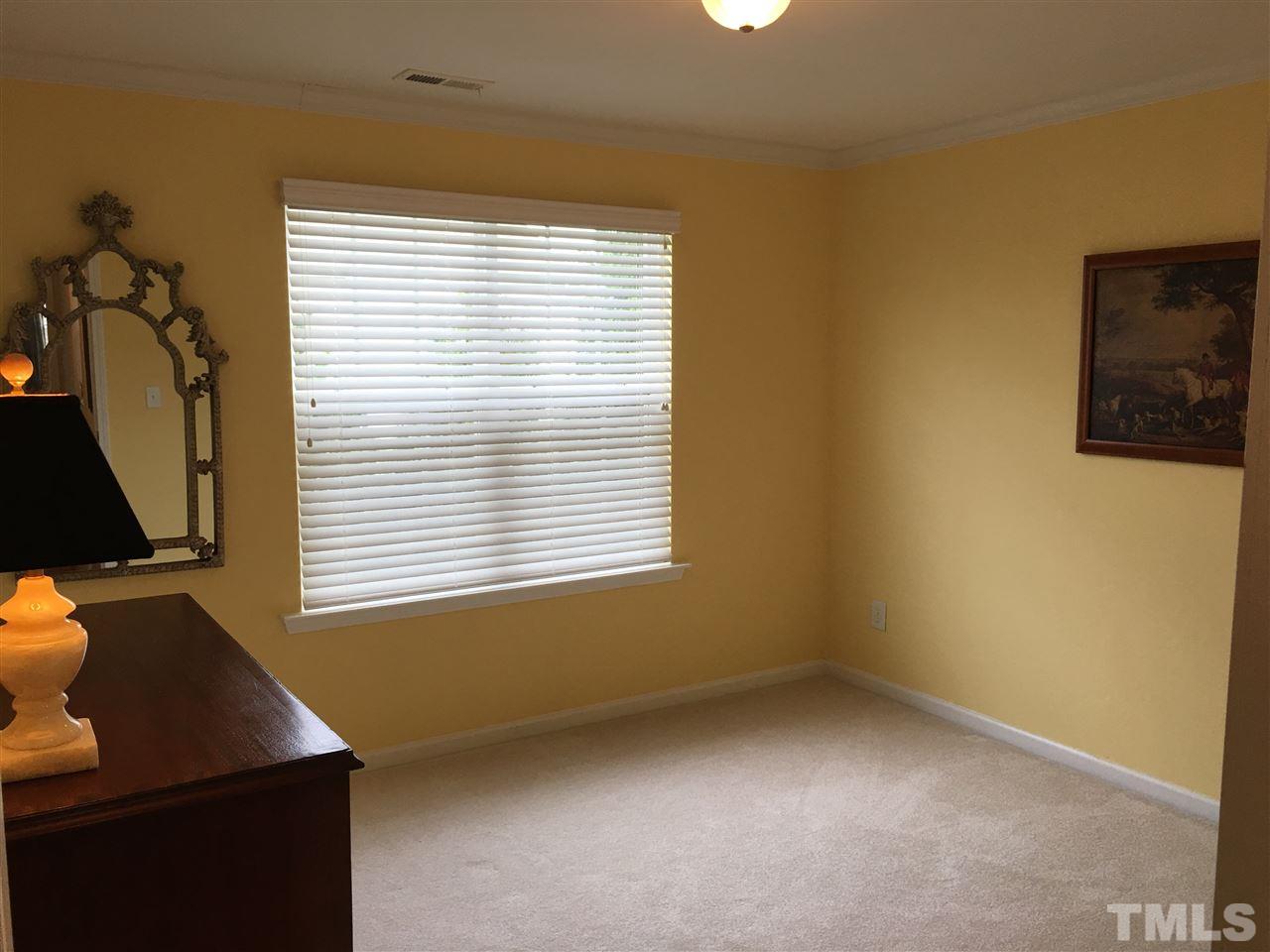 7634 Winners Edge Street Raleigh, NC 27617 - Photo 13 of 22 a view of an empty room with a window