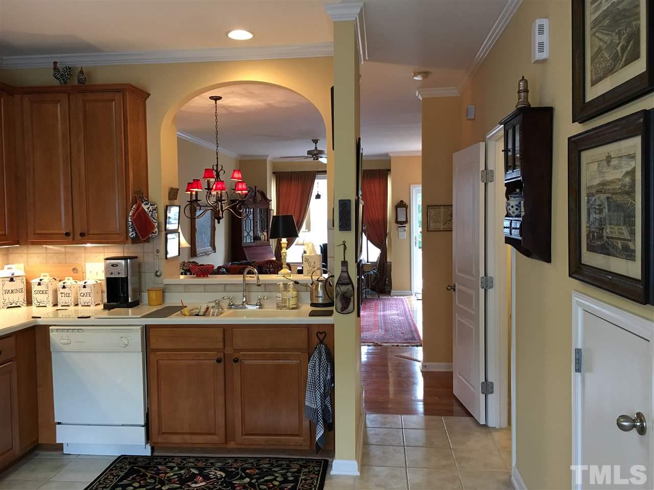 7634 Winners Edge Street Raleigh, NC 27617 - Photo 9 of 22 a kitchen with a sink and cabinets