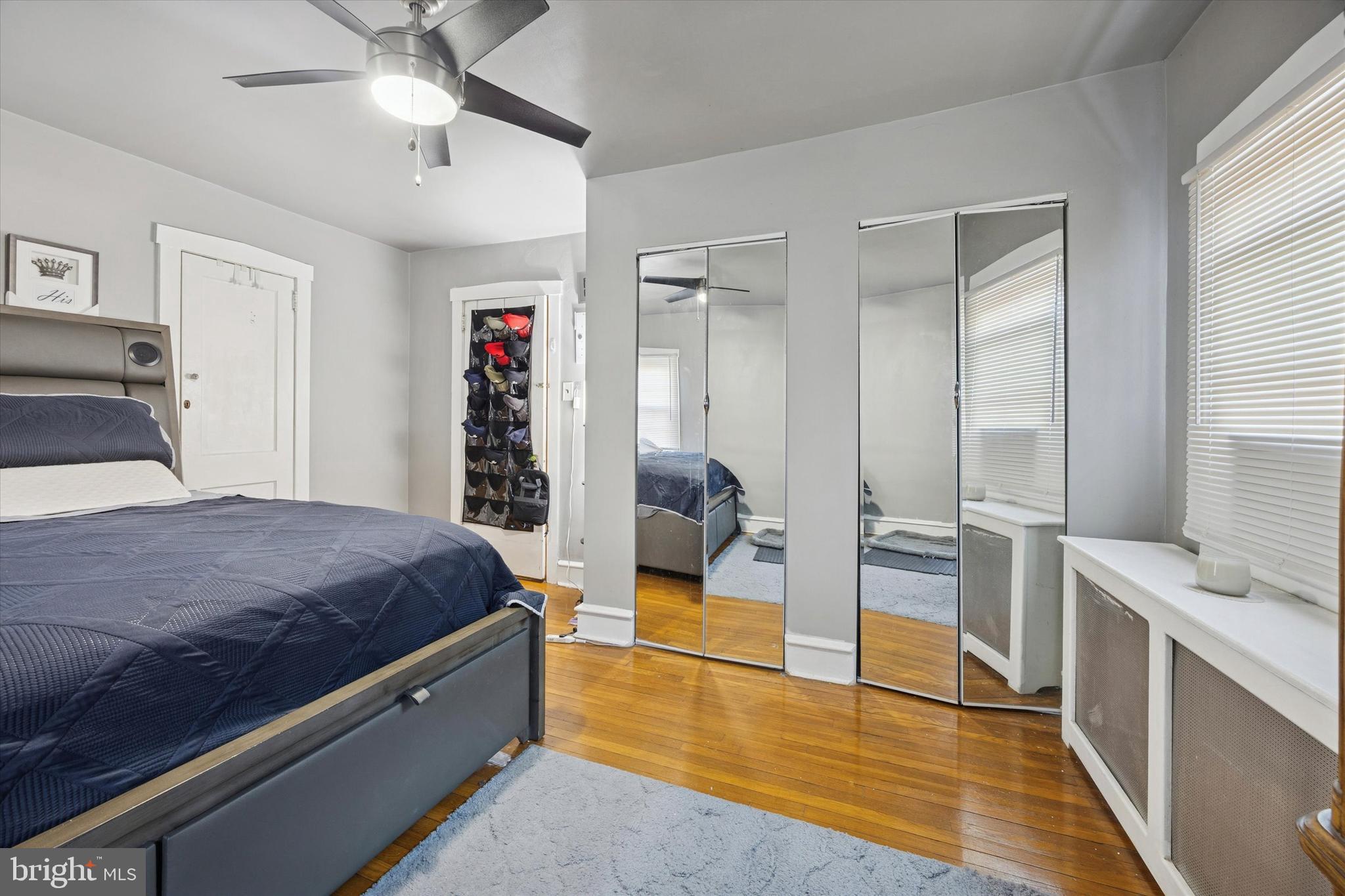 78 Marshall Road Lansdowne, PA 19050 - Photo 20 of 26 a spacious bedroom with a large bed and a chandelier