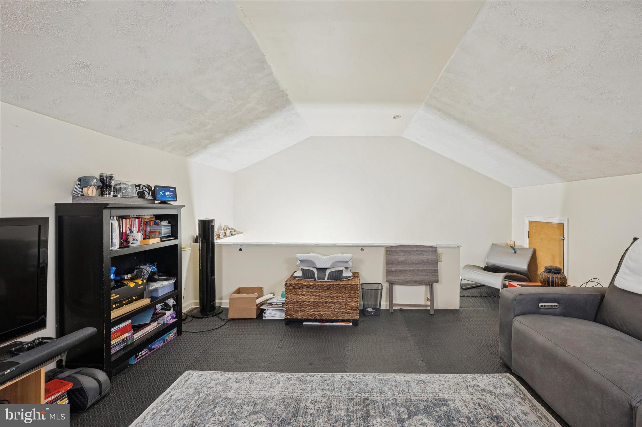 78 Marshall Road Lansdowne, PA 19050 - Photo 22 of 26 a living room with furniture and a flat screen tv