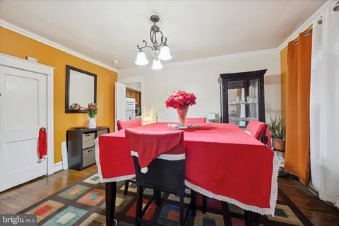 a view of a dining room with furniture and window