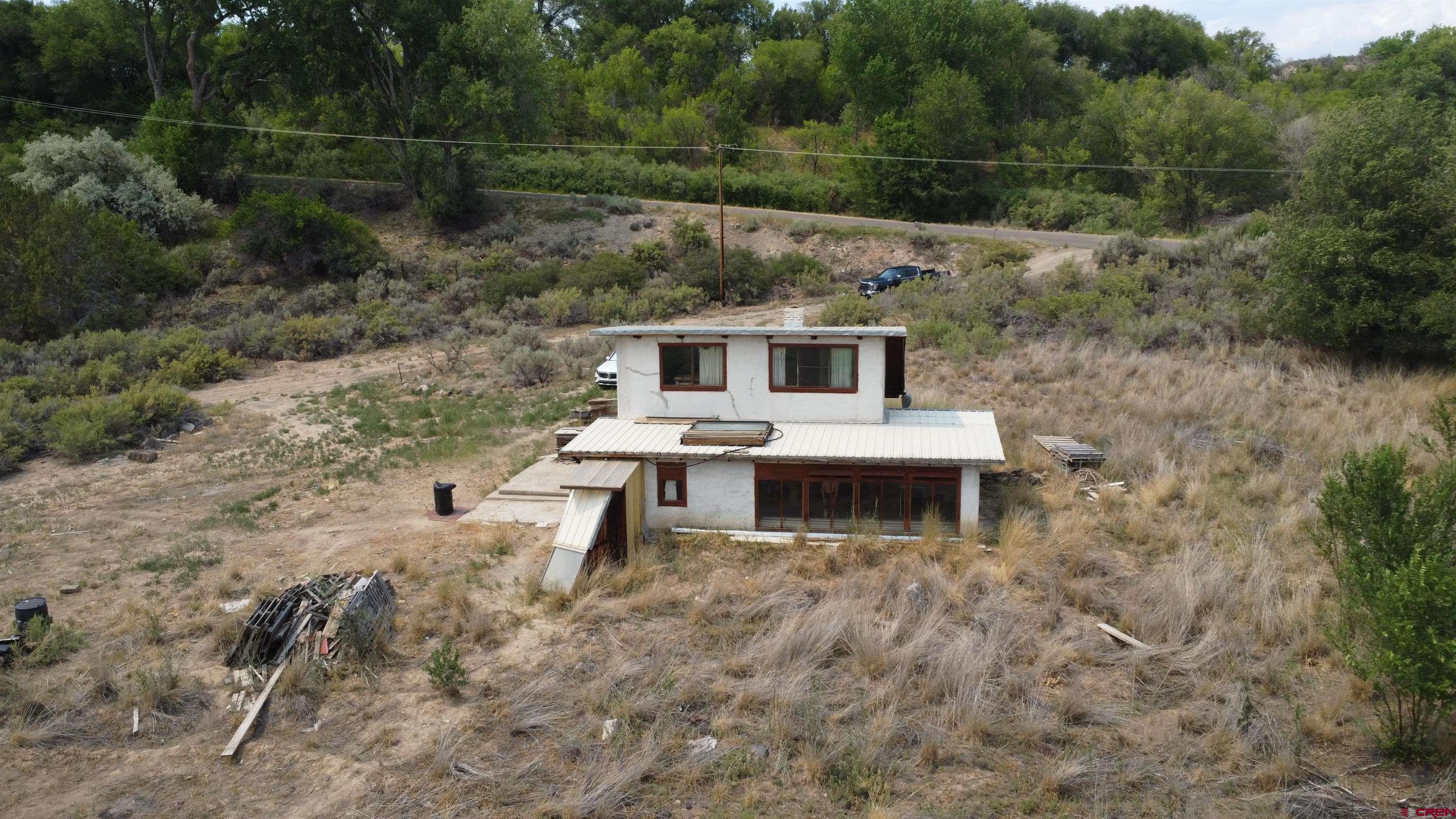21538 Hamilton Road Eckert, CO 81418 - Photo 6 of 9 a aerial view of a house with a yard