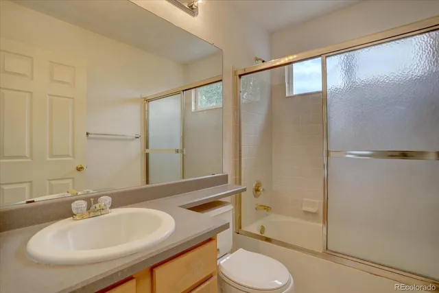 a view of room with window and wooden floor