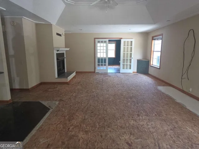 an empty room with windows