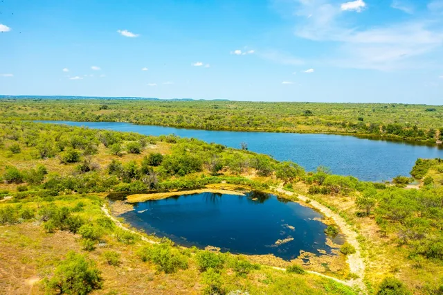 a view of an ocean and a yard