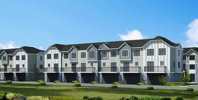 a front view of residential houses with street view