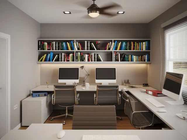 a view of a workspace with furniture and a book shelf