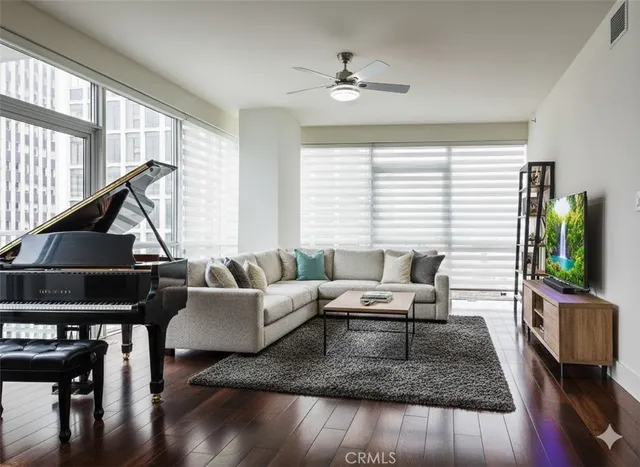 a living room with furniture and a flat screen tv