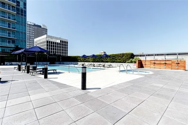 a swimming pool with outdoor seating
