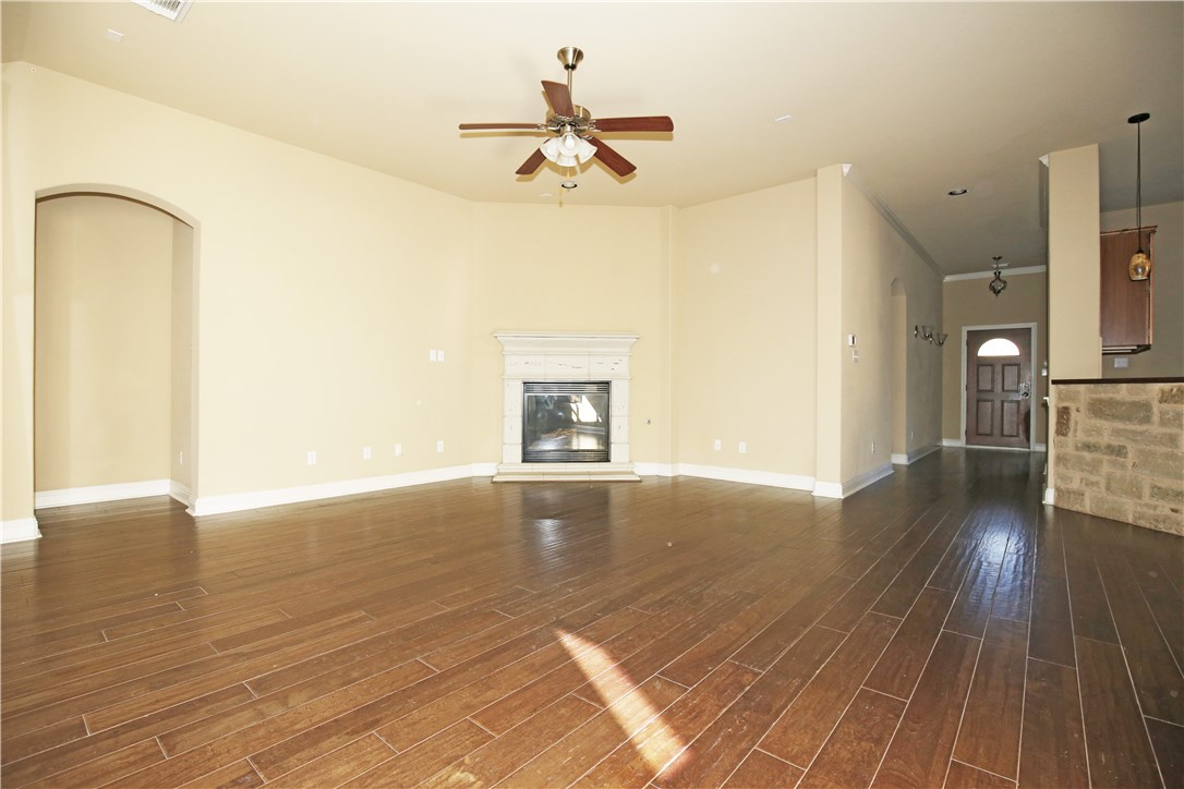 3921 Sapphire Loop Round Rock, TX 78681 - Photo 12 of 24 a view of a room with wooden floor and a ceiling fan