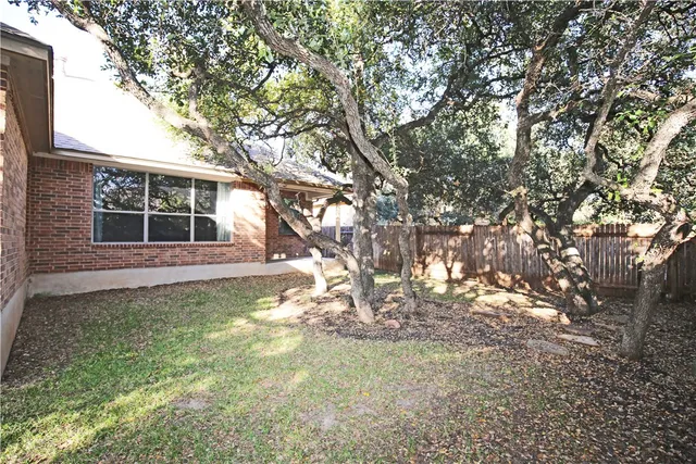 a backyard of a house with lots of green space