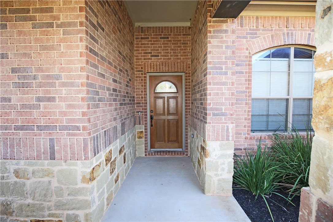 3921 Sapphire Loop Round Rock, TX 78681 - Photo 3 of 24 a view of entryway with a brick wall