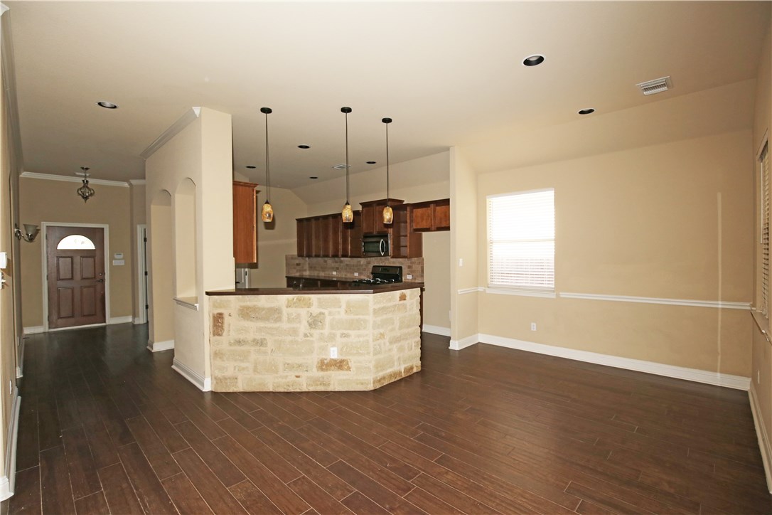 3921 Sapphire Loop Round Rock, TX 78681 - Photo 6 of 24 a room with wooden floors and white walls