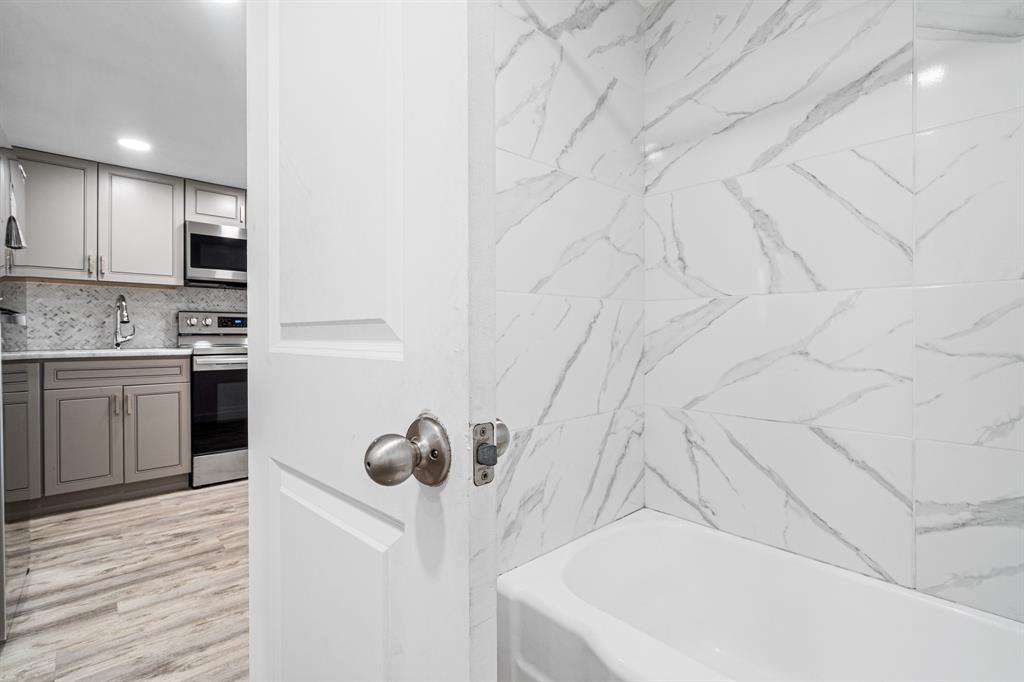 1110 North Riverside Drive, Unit 20 Pompano Beach, FL 33062 - Photo 17 of 32 a bathroom with a sink and a mirror