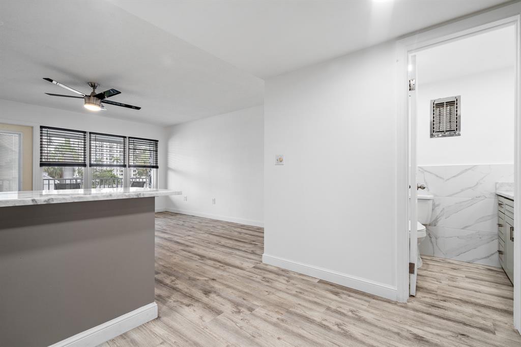 1110 North Riverside Drive, Unit 20 Pompano Beach, FL 33062 - Photo 23 of 32 a furnished livingroom with a window