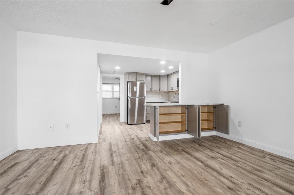 1110 North Riverside Drive, Unit 20 Pompano Beach, FL 33062 - Photo 27 of 32 a view of kitchen and wooden floor