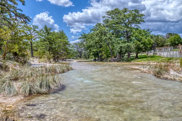 a view of a pathway both side of yard