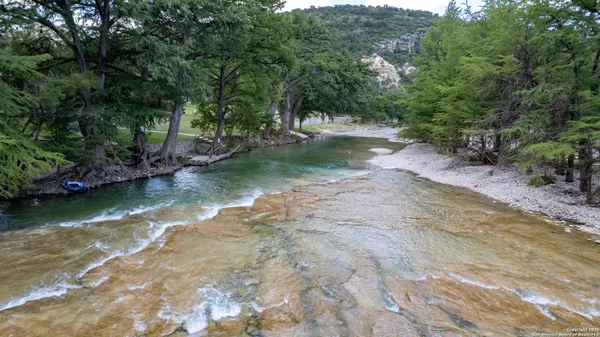 swimming pool view with a seating space